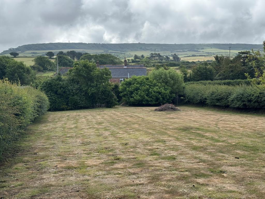 Lot: 53 - TRADITIONAL FARMHOUSE FOR IMPROVEMENT WITH BARNS AND OUTBUILDINGS ON A 2.5 ACRE PLOT - Looking back from the Gardens Towards the House